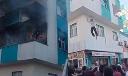 Şanlıurfa'da korku dolu anlar! Yangında balkonda mahsur kalan genç kız ve çocuk battaniyeye atlayarak kurtuldu